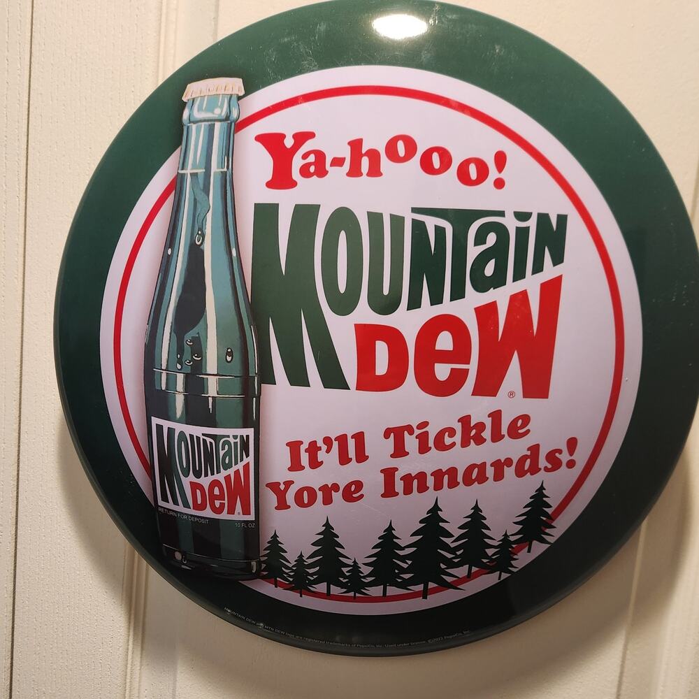 Mountain Dew Ya-Hooo! It'll Tickle Yore Innards Round Metal Tin Sign 16"